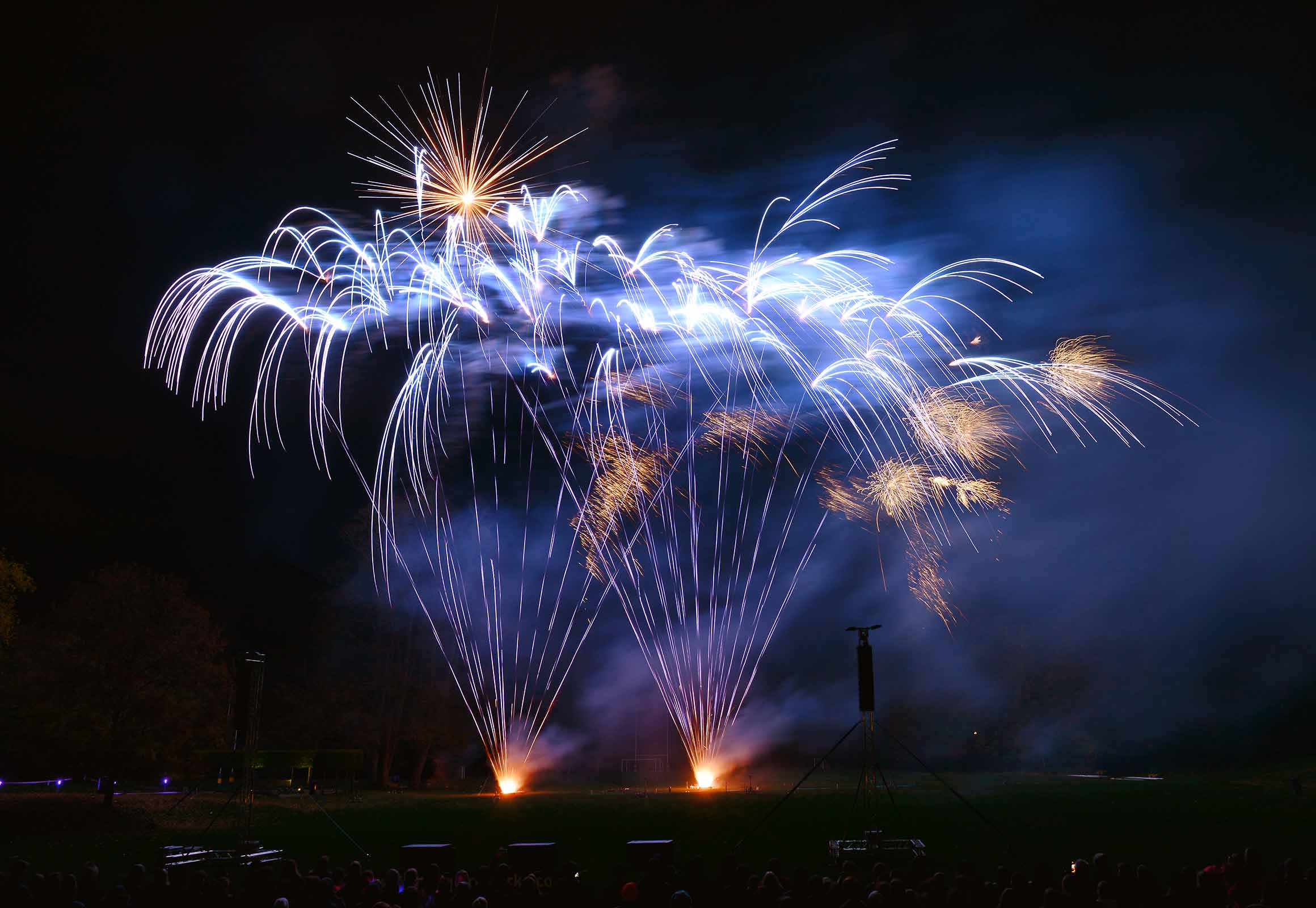 Corporate event pyromusical display with branded colours